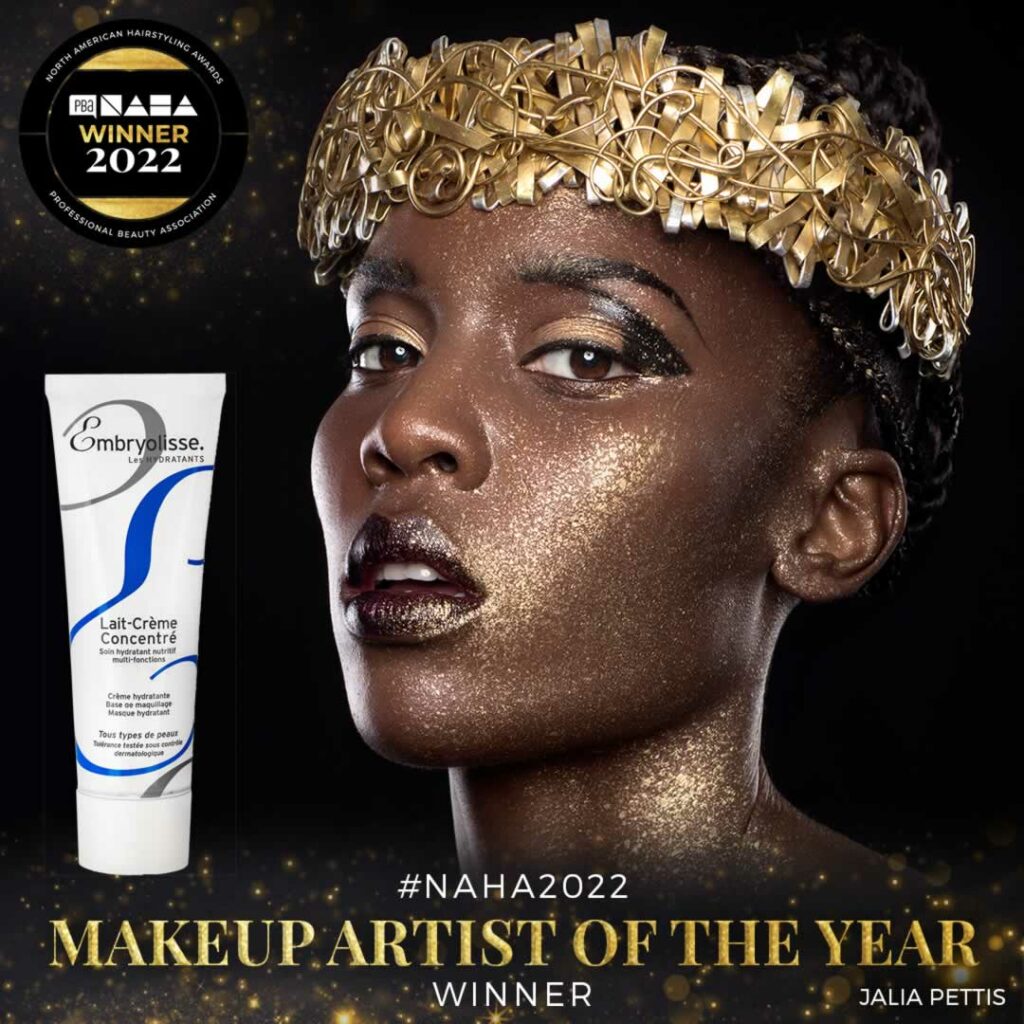 A sign showing a tube of Lait Creme Concentre next to the face of a black model with a golden tiara on her head. A sign in large letters at the bottom says Makeup Artist of the year