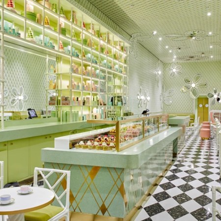 The Laduree store in Beverly HIlls. Black and white floor and pale green paint on walls.