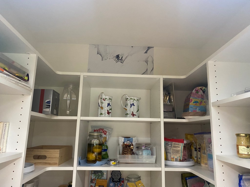 Same white space with one piece of wallpaper with peonies glued in the middle of the way