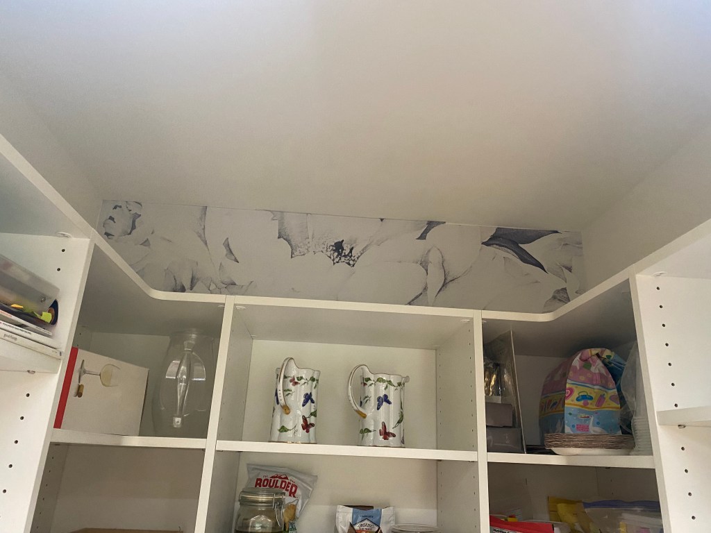 3 pieces of wallpaper with peonies side by side on the wall